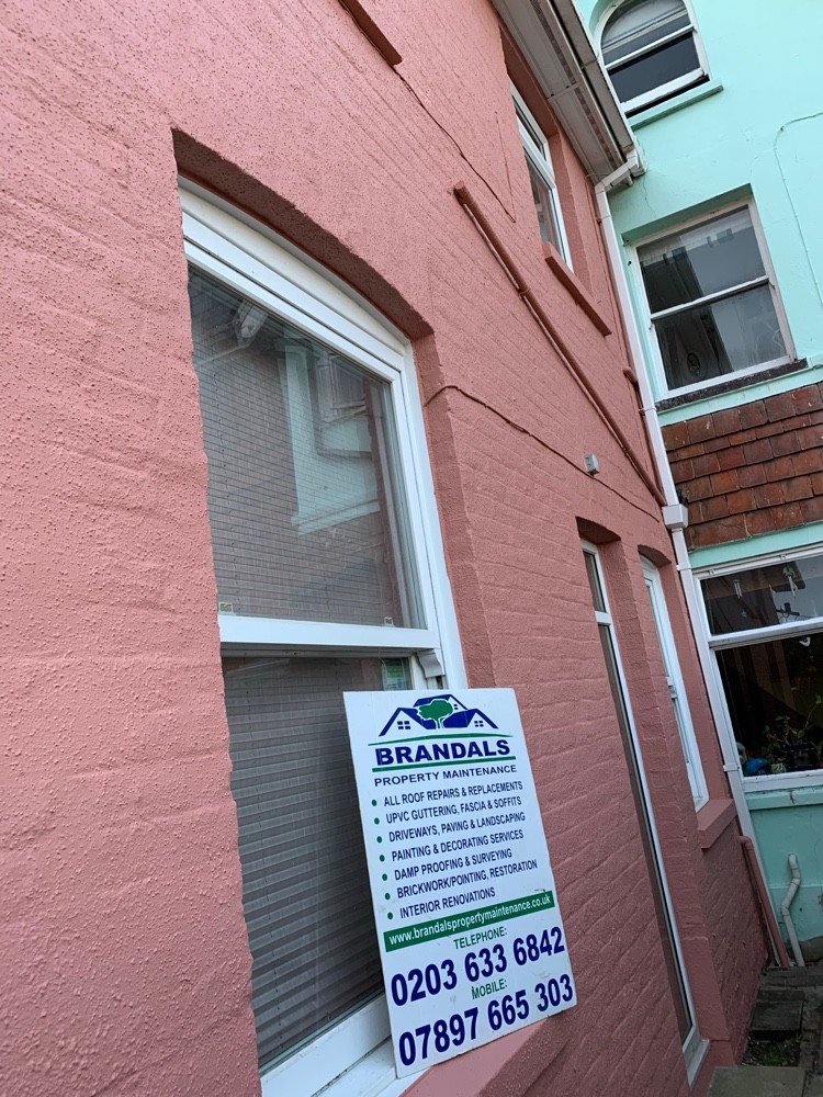 Freshly painted rendered terrace completed by Brandals