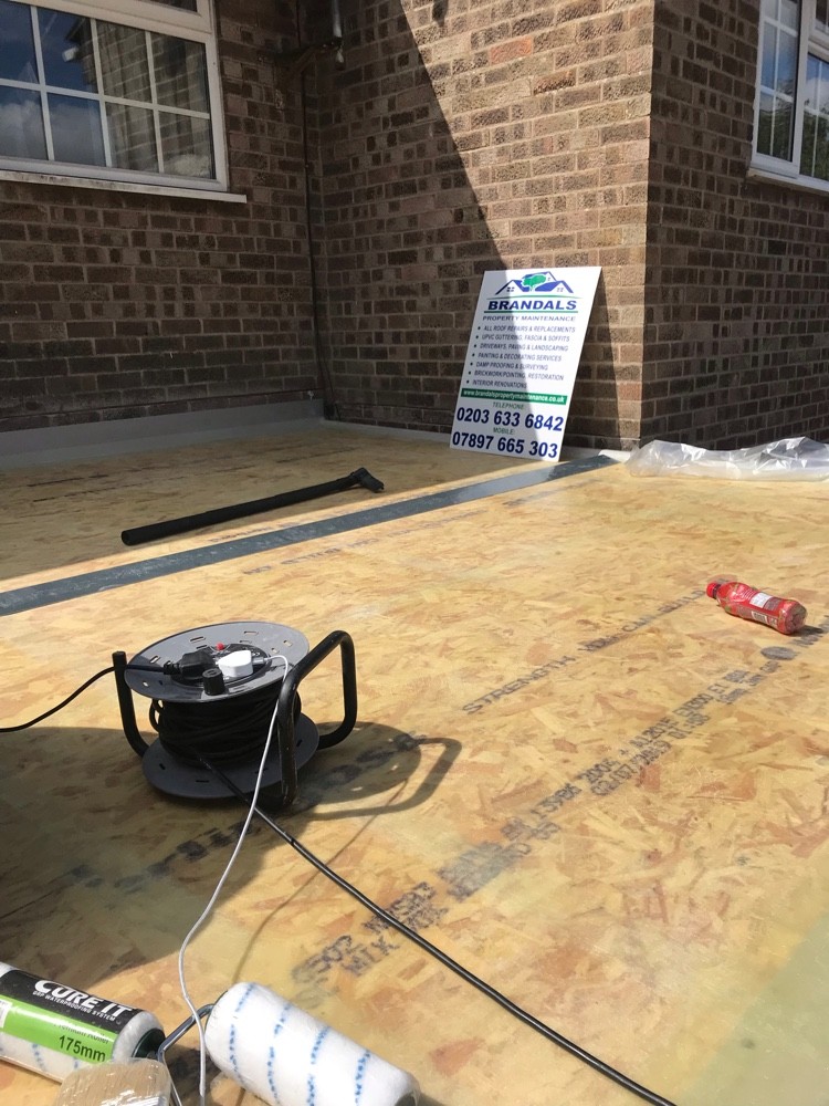New flat roof OSB decking with Brandals site board